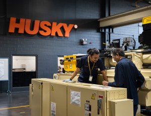 factory box packing area with the sign saying husky in the background
