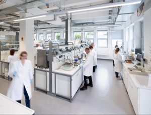 scientists working on lab equipment