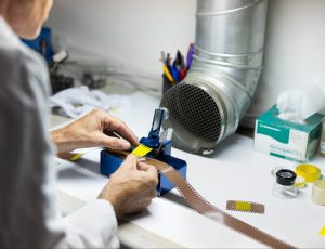 scientist working on lab equipment | Platinum Equity