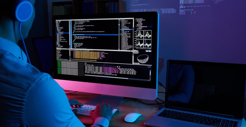 man in front of a computer
