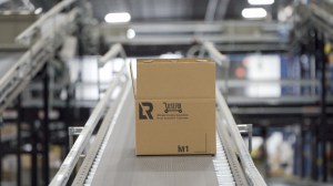opened box on a conveyor belt