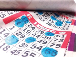 Bingo paper with stamps image | Platinum Equity