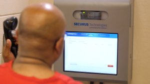 A man looking at the monitor