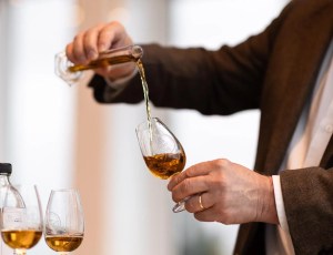 Man pouring wine in a glass
